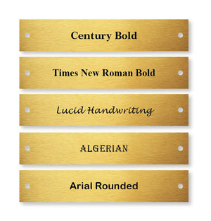 Gold nameplates with different font styles on a white background